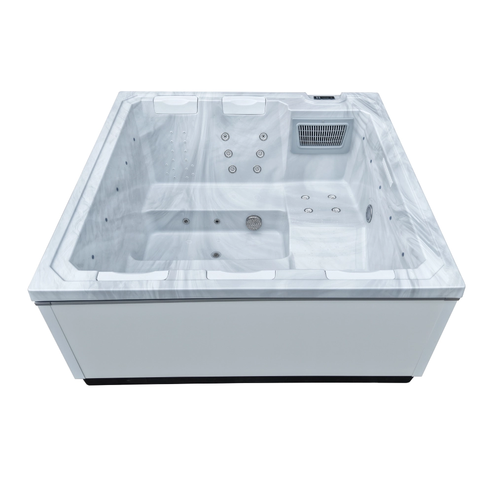Frontansicht des Whirlpools JJSPA Beta 414 mit weißer Wanne in Marmoroptik, Kopfstützen, Massagedüsen und Filter.