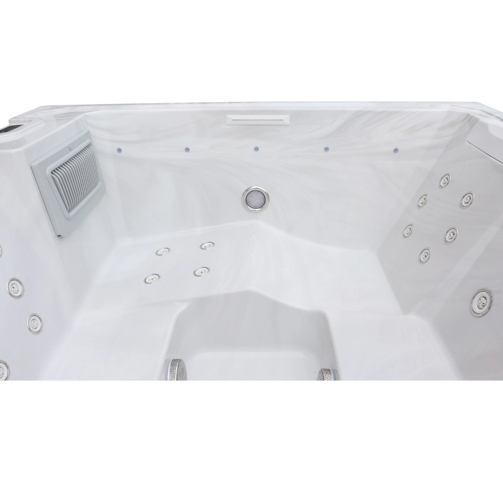 Innenraum des Whirlpools JJSPA Beta 414 mit Massagedüsen an den Sitzen, Filtergehäuse und Wasserfallauslass.
