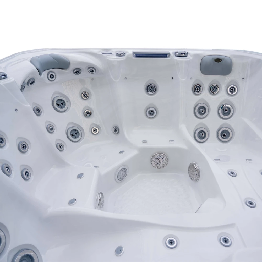 Ergonomische Sitze und Massagedüsen des JJSPA Beta 523 Whirlpools, Weißmarmor-Acryl.